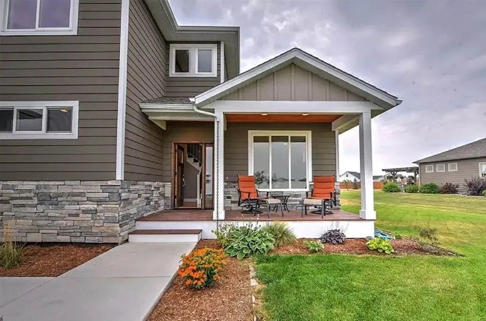 A bathroom with a bathtub and a skylight in the ceiling