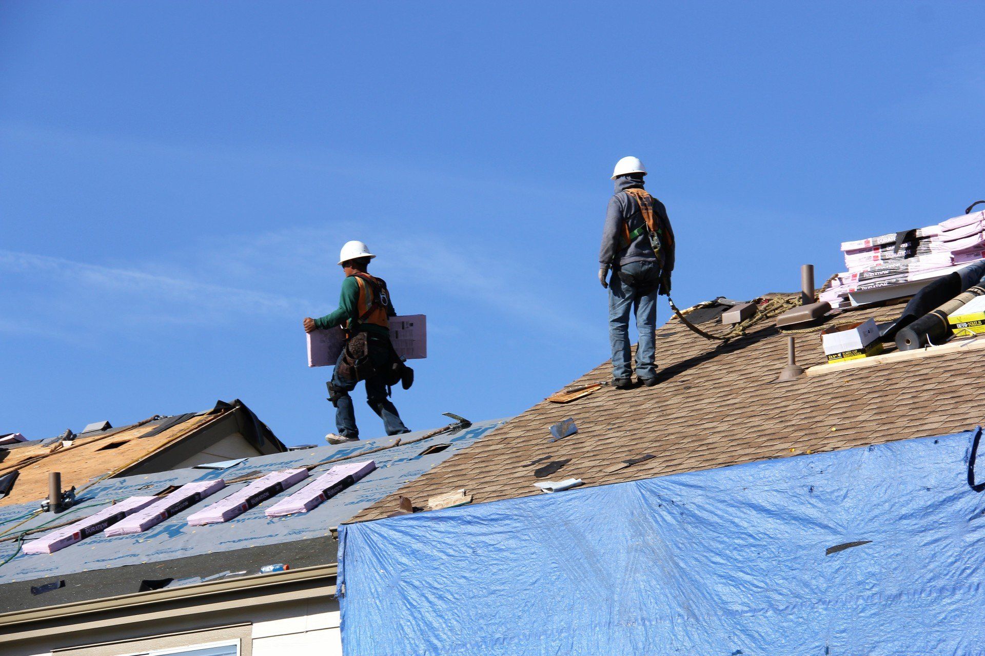 The crew is in the process of outfitting a property with a new roof.
