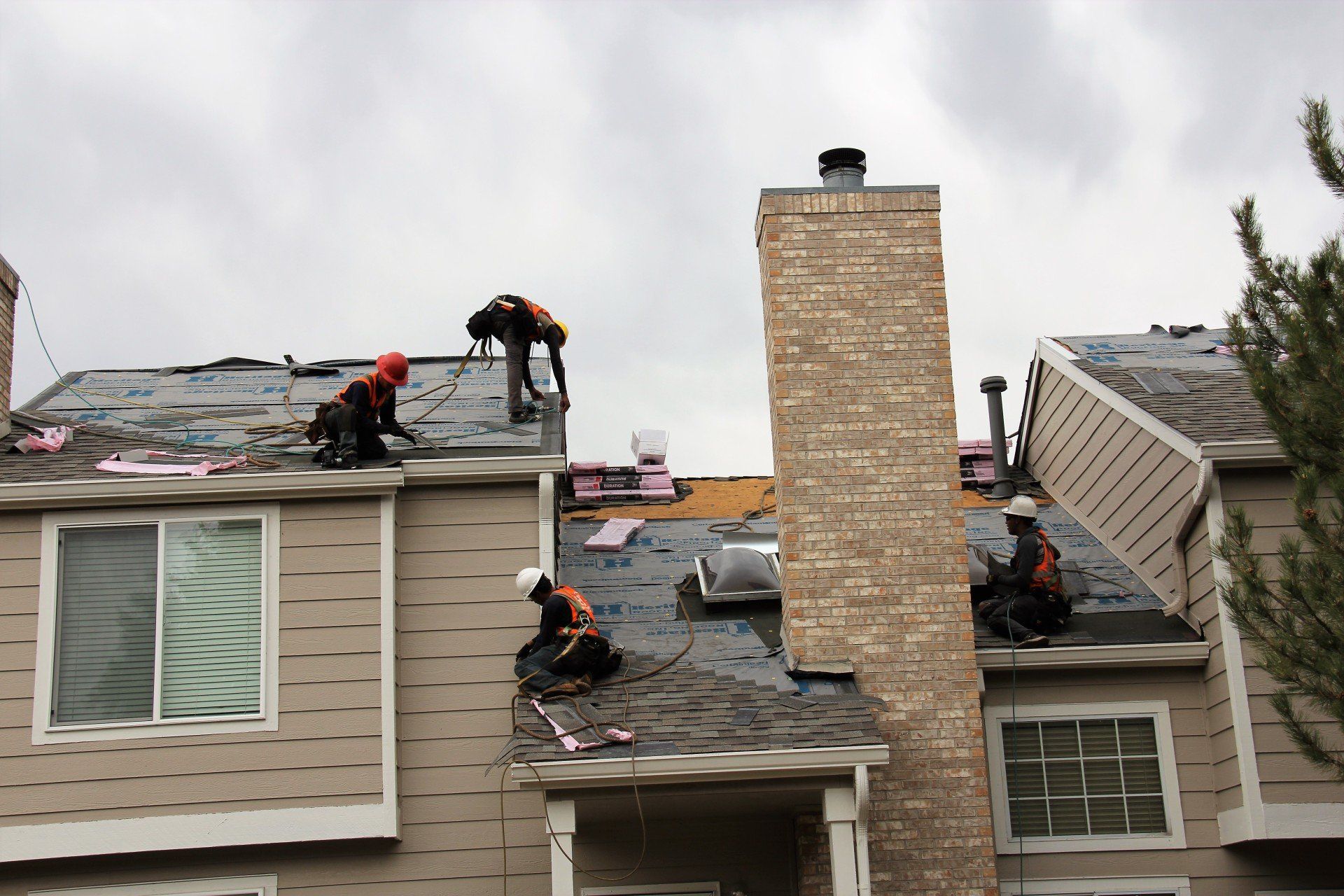 Our roofing team is installing a new roof on a multi-height building.