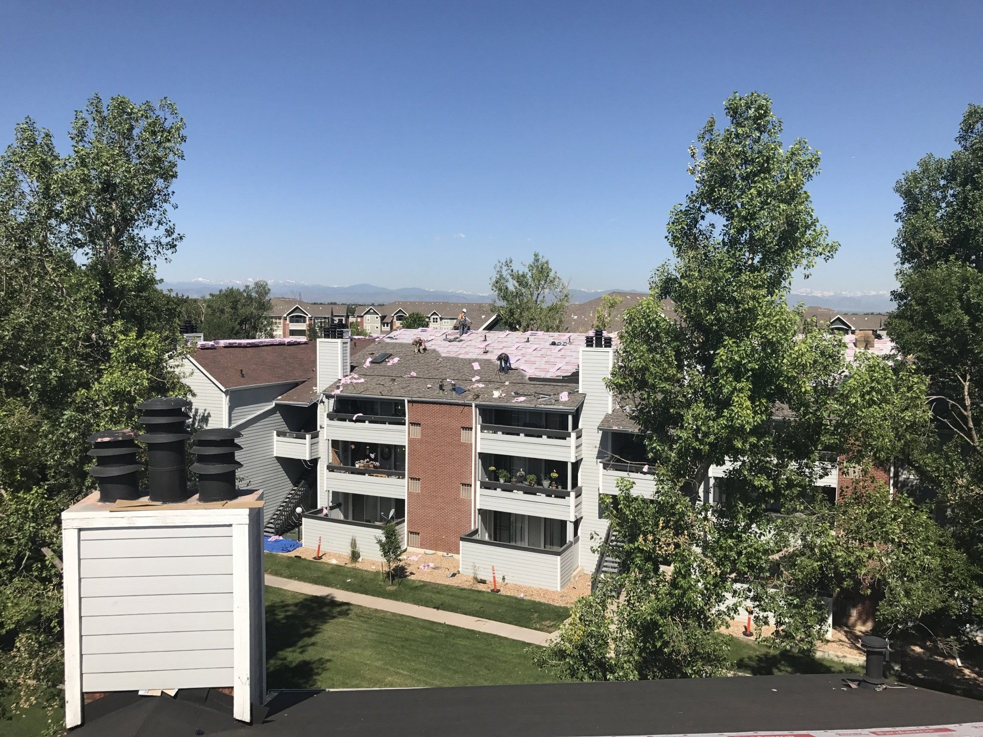 The materials have been prepped and the shingles are being installed.