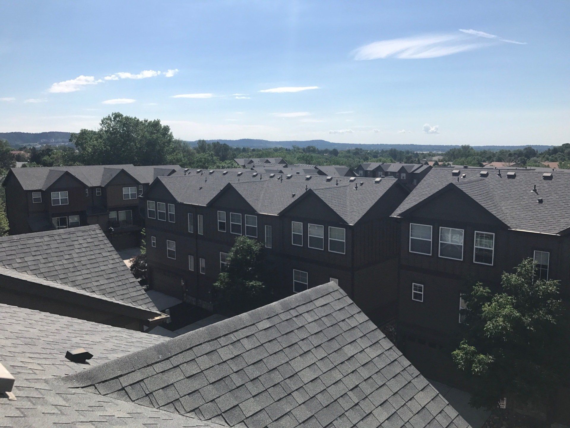 A multi-family complex has a new shiny roof.