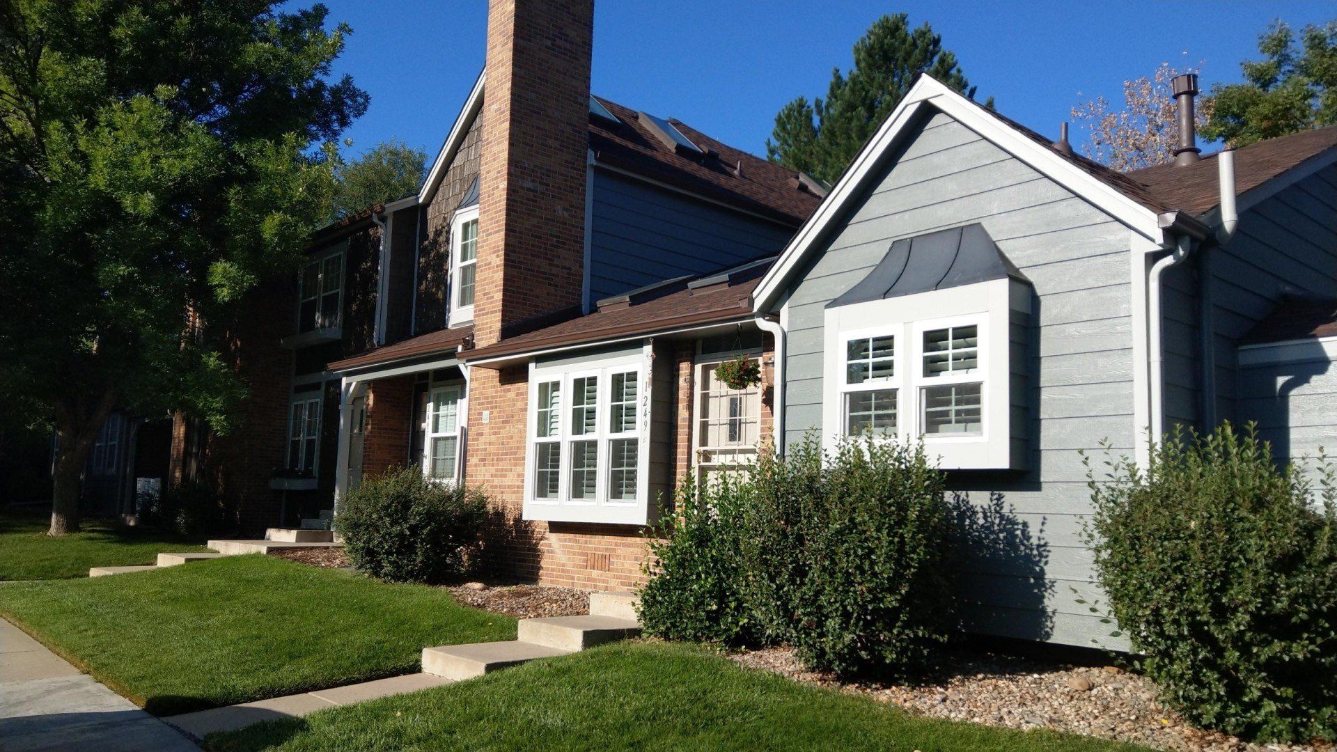 A beautiful multi-family complex has freshly installed windows.