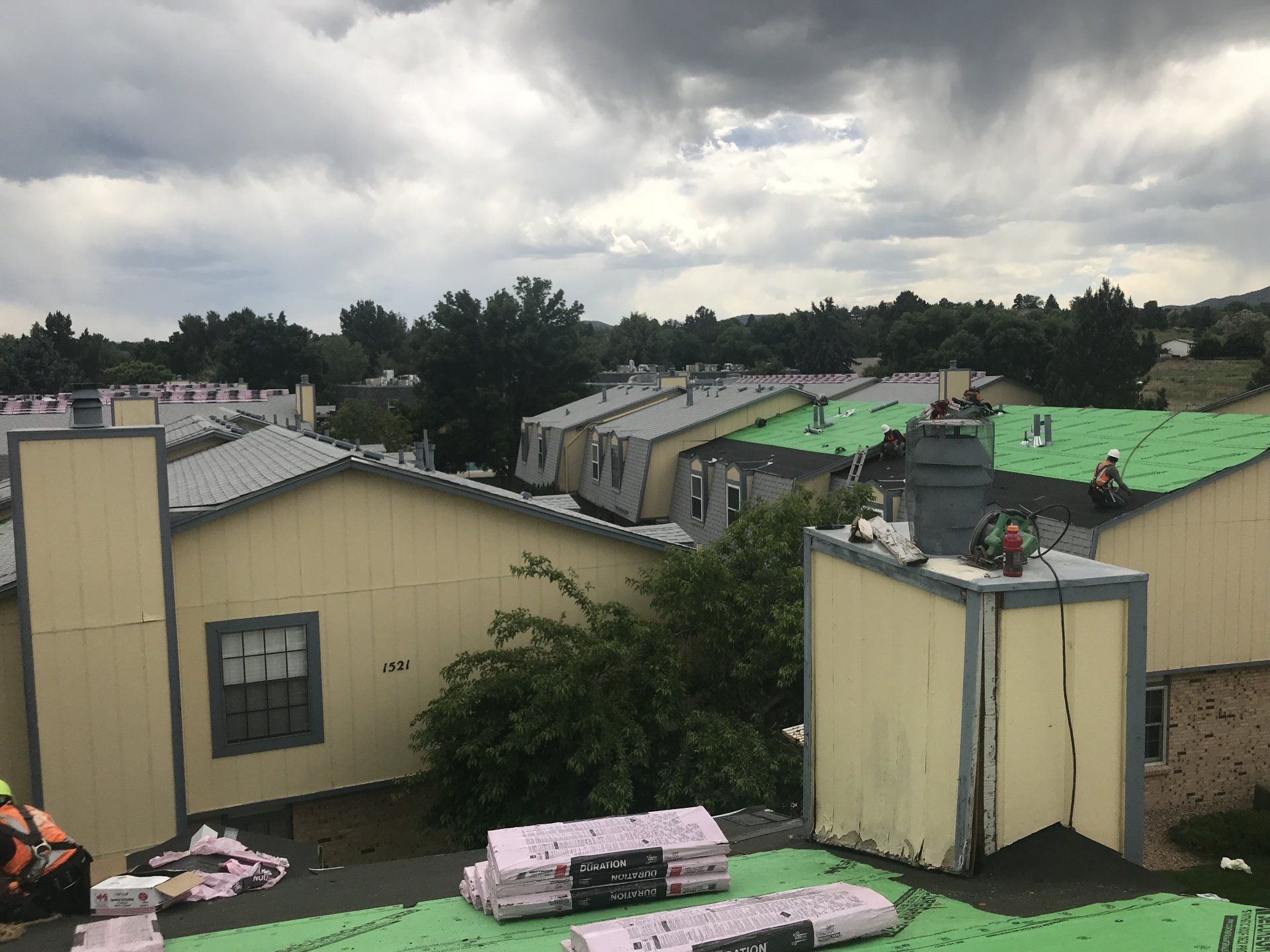 A multi-family complex in the midst of getting a new roof.