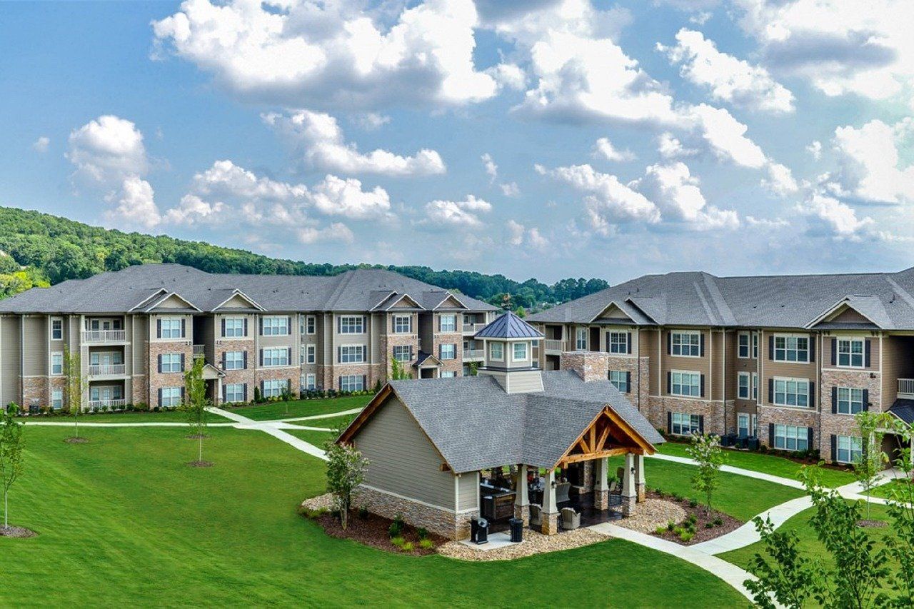 Heritage Roofing & Contracting provides roofing services for HOA, apartments & multi-family properties. Image is of a multi-family property