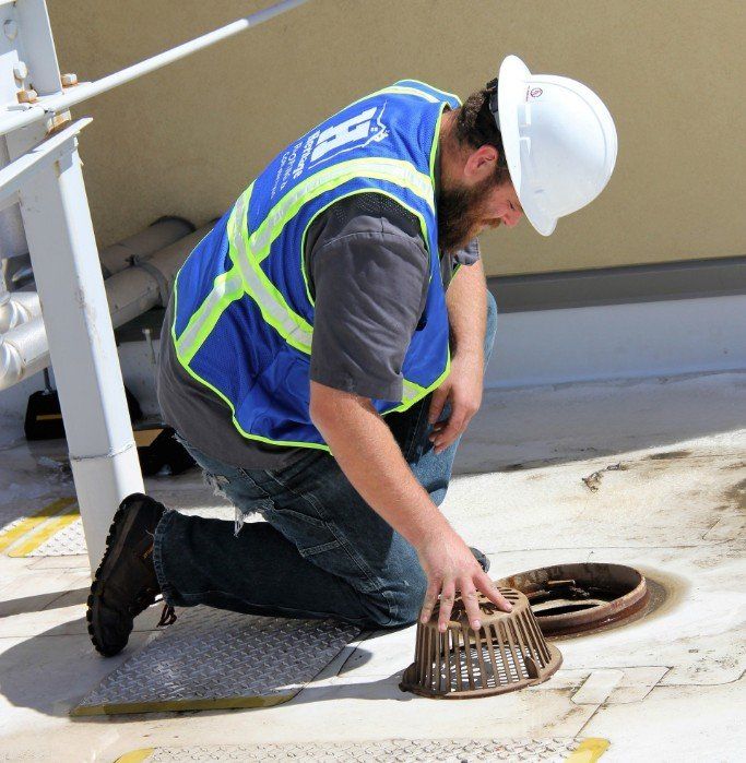 We offer a variety of repair & contracting services. Image is of one of our service technicians out in the field.
