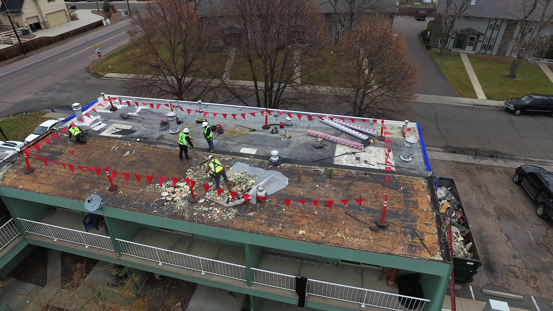 Aerial view of a commercial flat roof being installed.