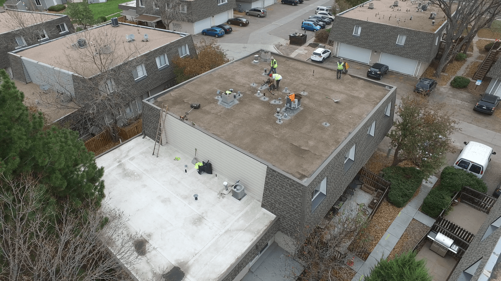 A flat roof is in the process of being prepped for a fresh coating.
