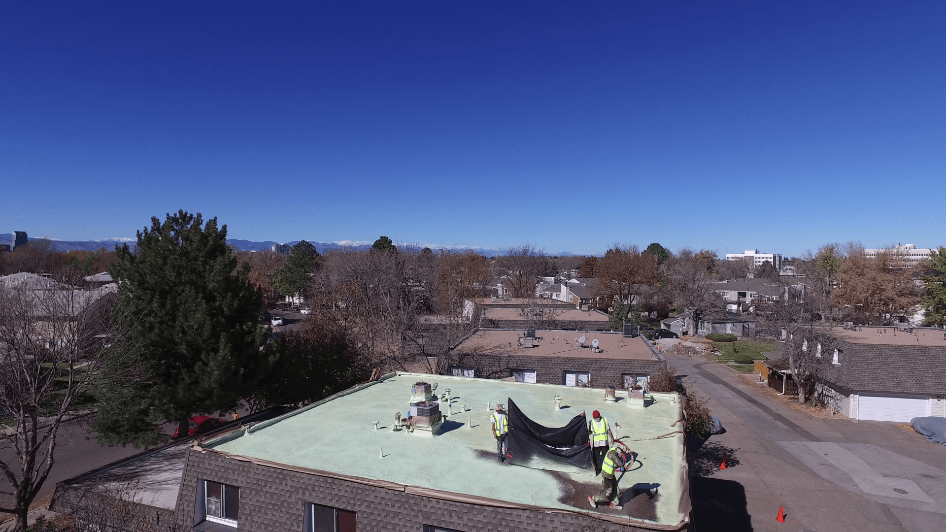 A flat roof in the Park Monaco complex is in the process of getting coated.