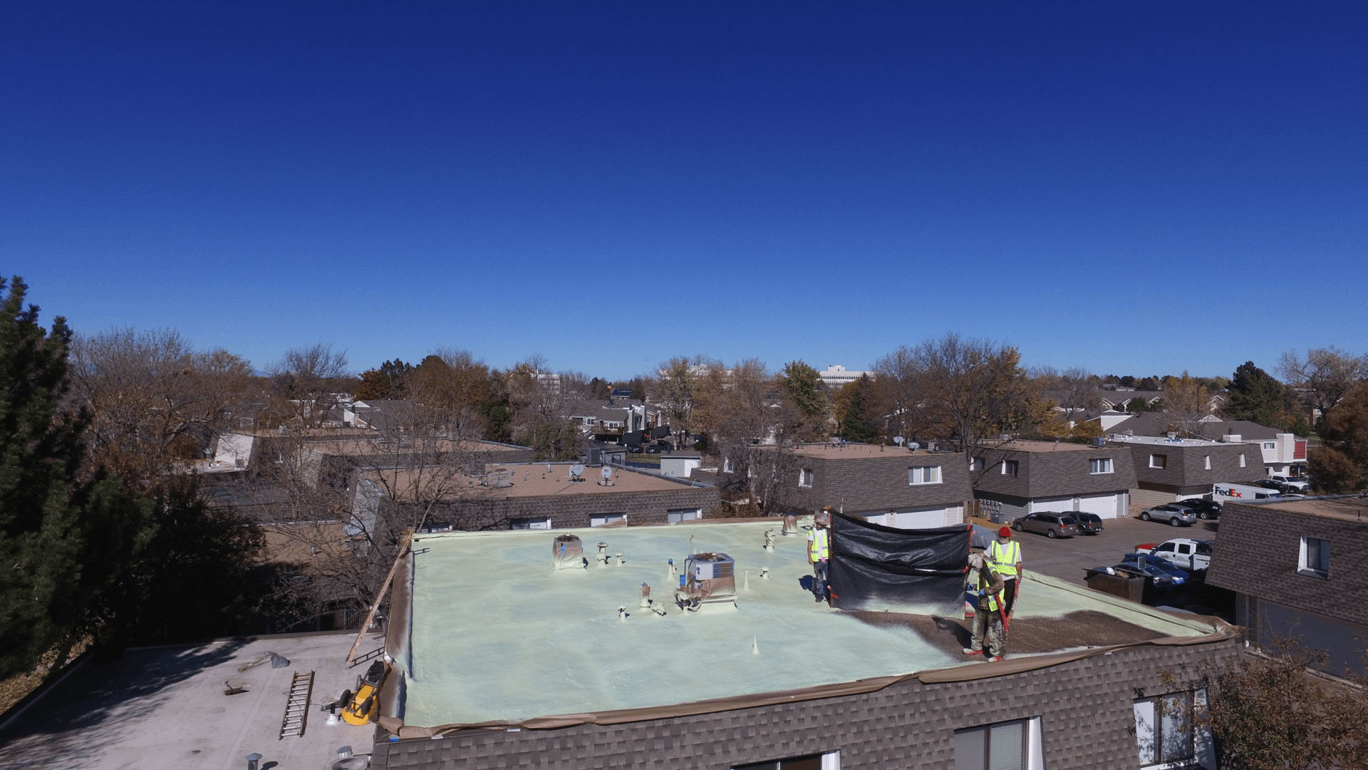 The crew works together to ensure a coating is installed correctly.