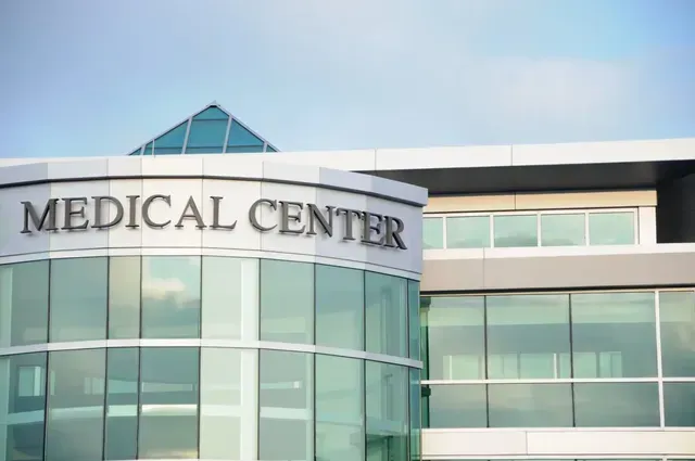 a large glass building with the word medical center on it