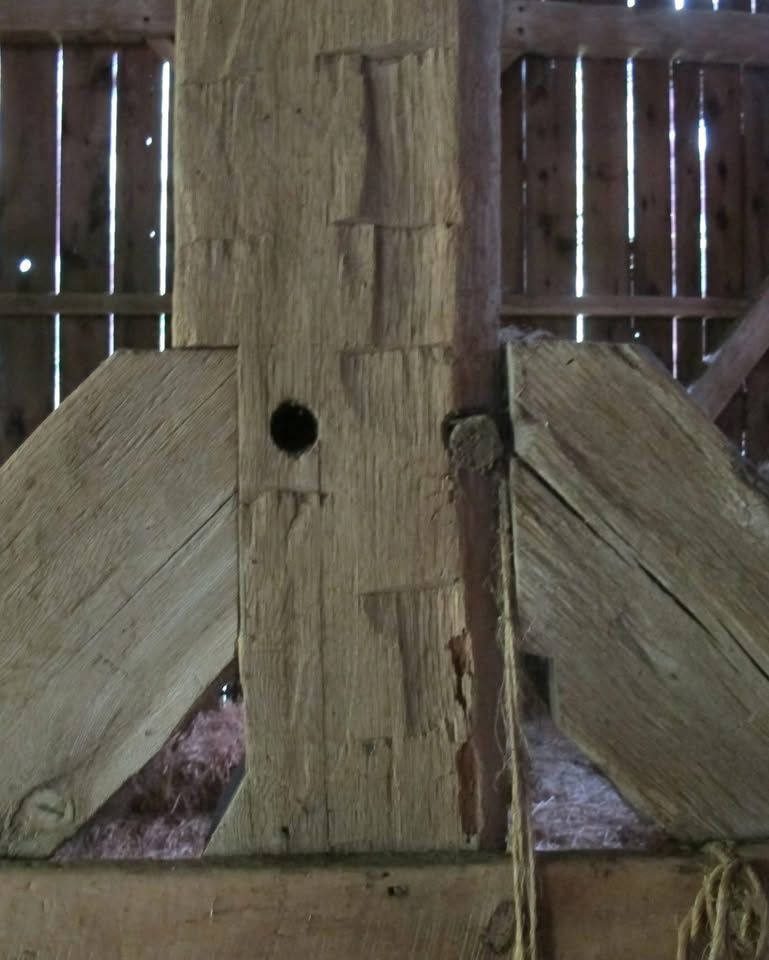 Close-up of aged beam in Pennsylvania showcasing fuming wood effect and natural rustic character.