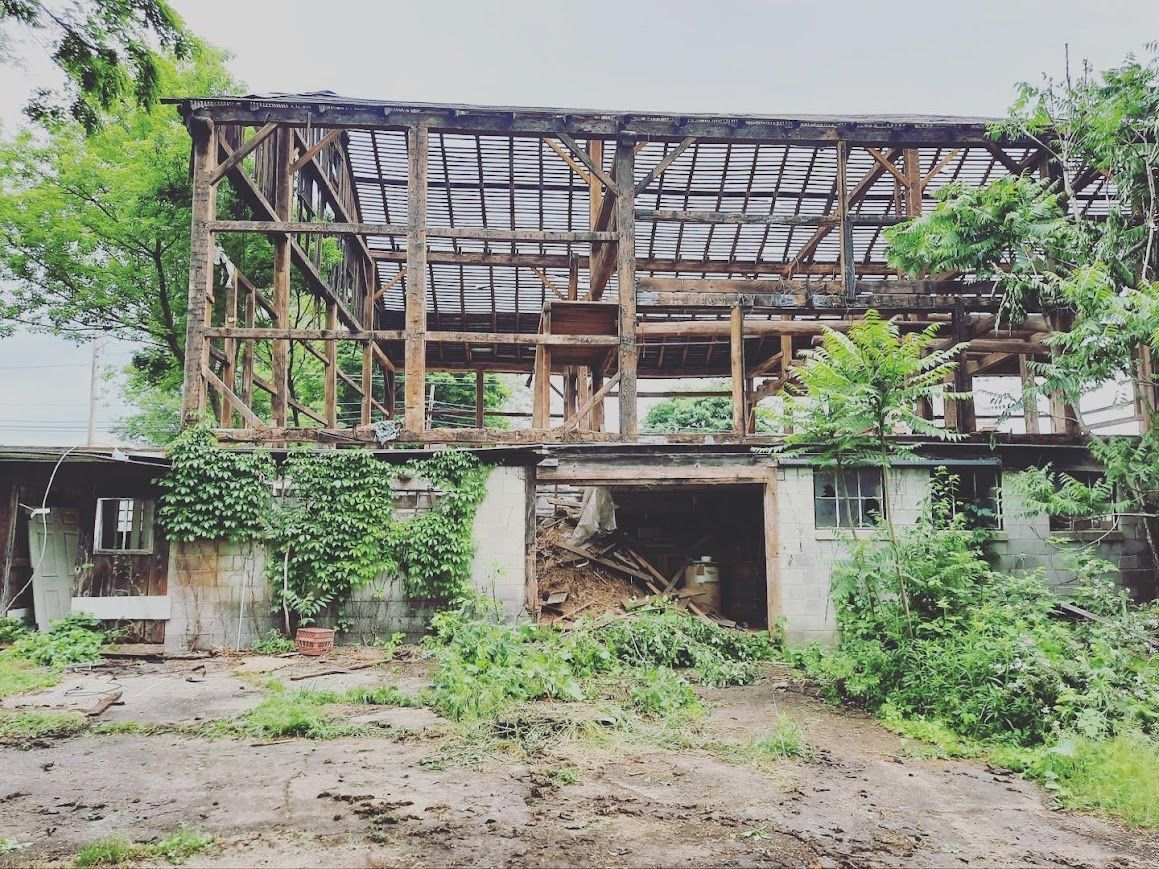 Partially collapsed wooden frame for heritage home restoration.