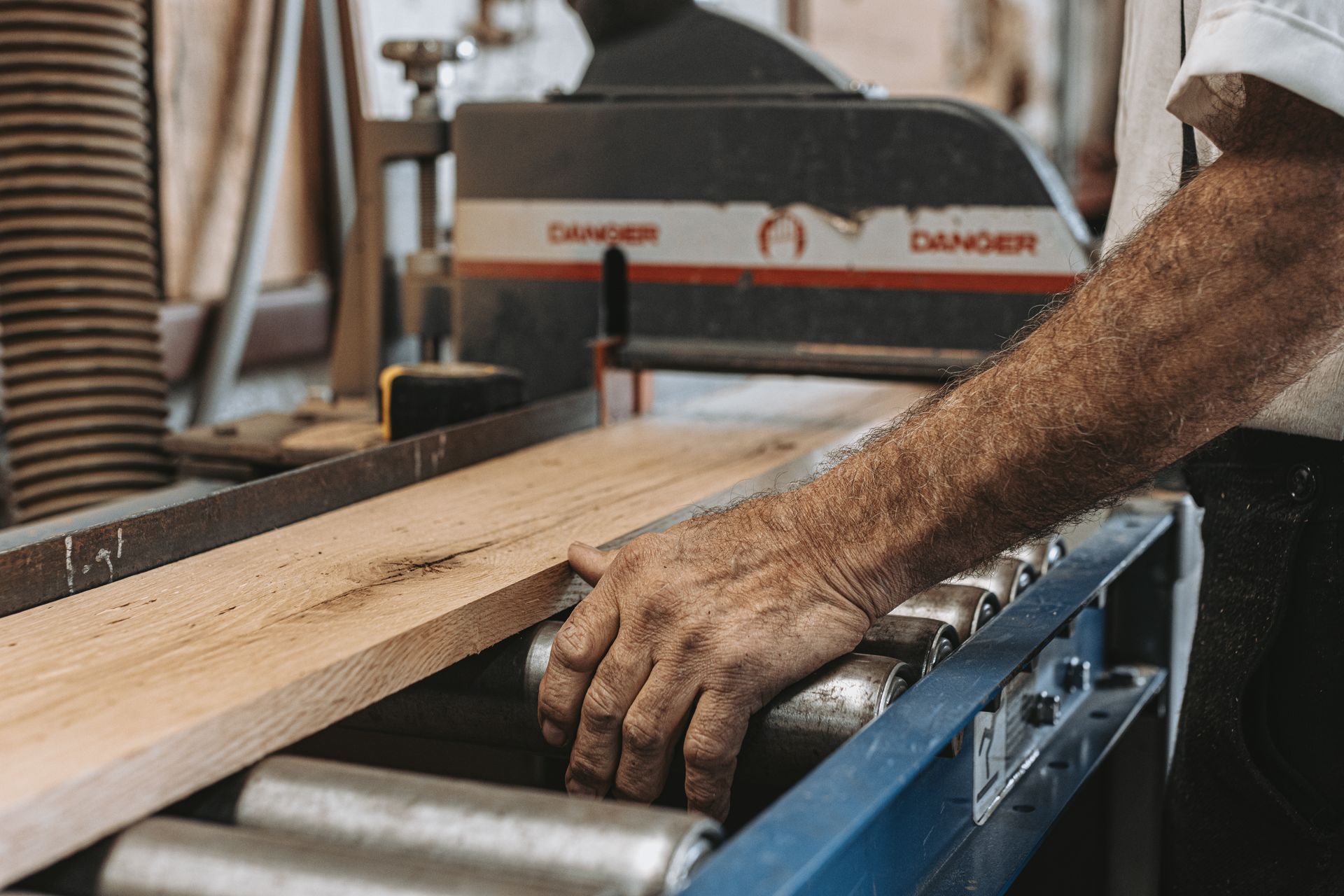Recycled timber processed by worker using woodworking machines in Pennsylvania.
