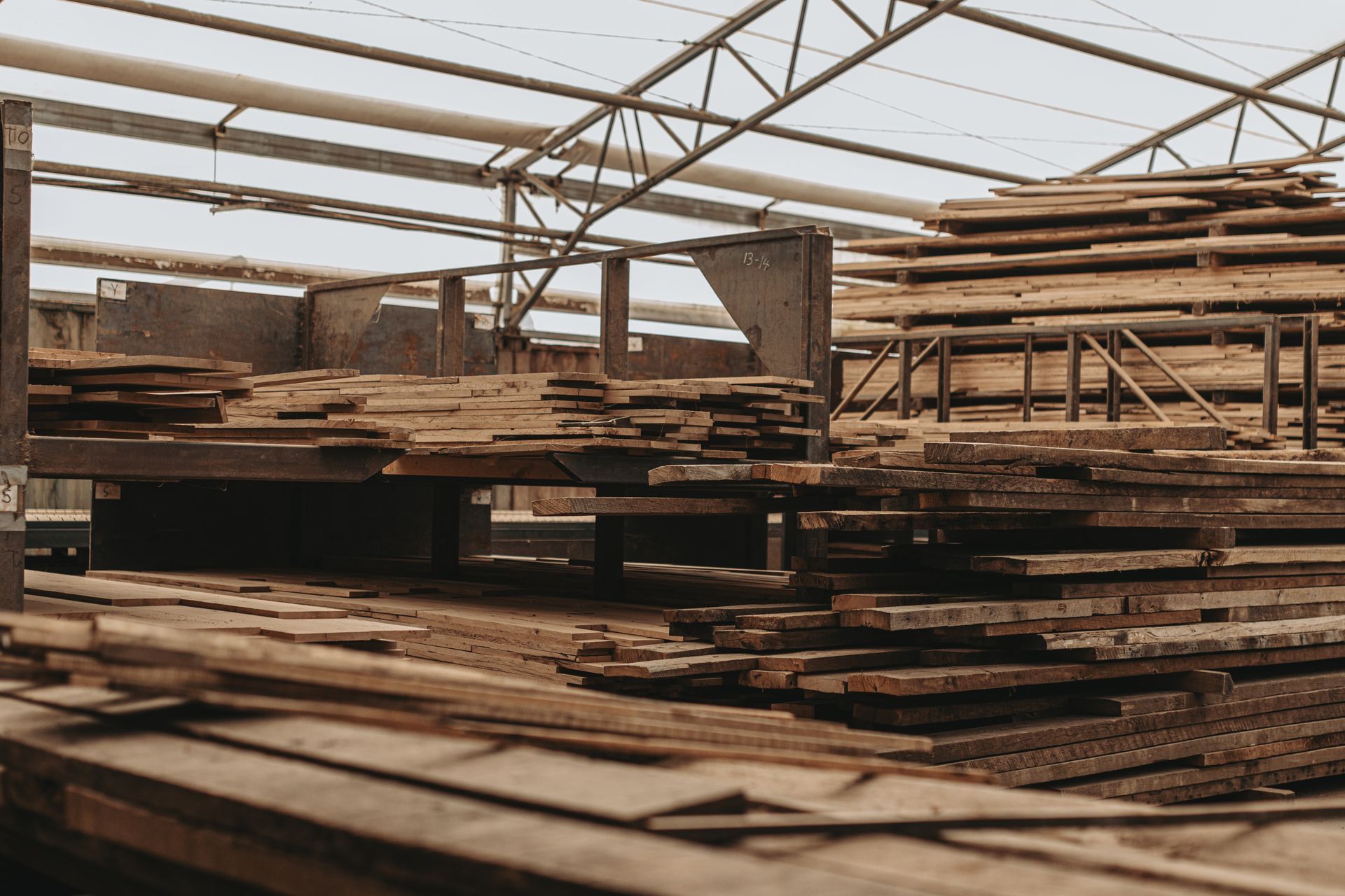 Bay & Bent Pennsylvania reclaimed wooden planks stored in an industrial warehouse for antique timber