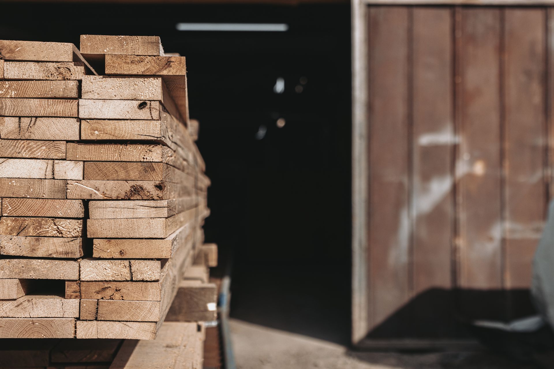 Close-up image of historic barn frame planks from timber frame suppliers.