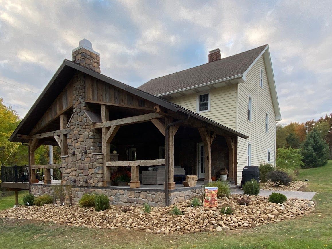 In Pennsylvania, rustic pole barn home features stone porch reflecting heritage design and style.