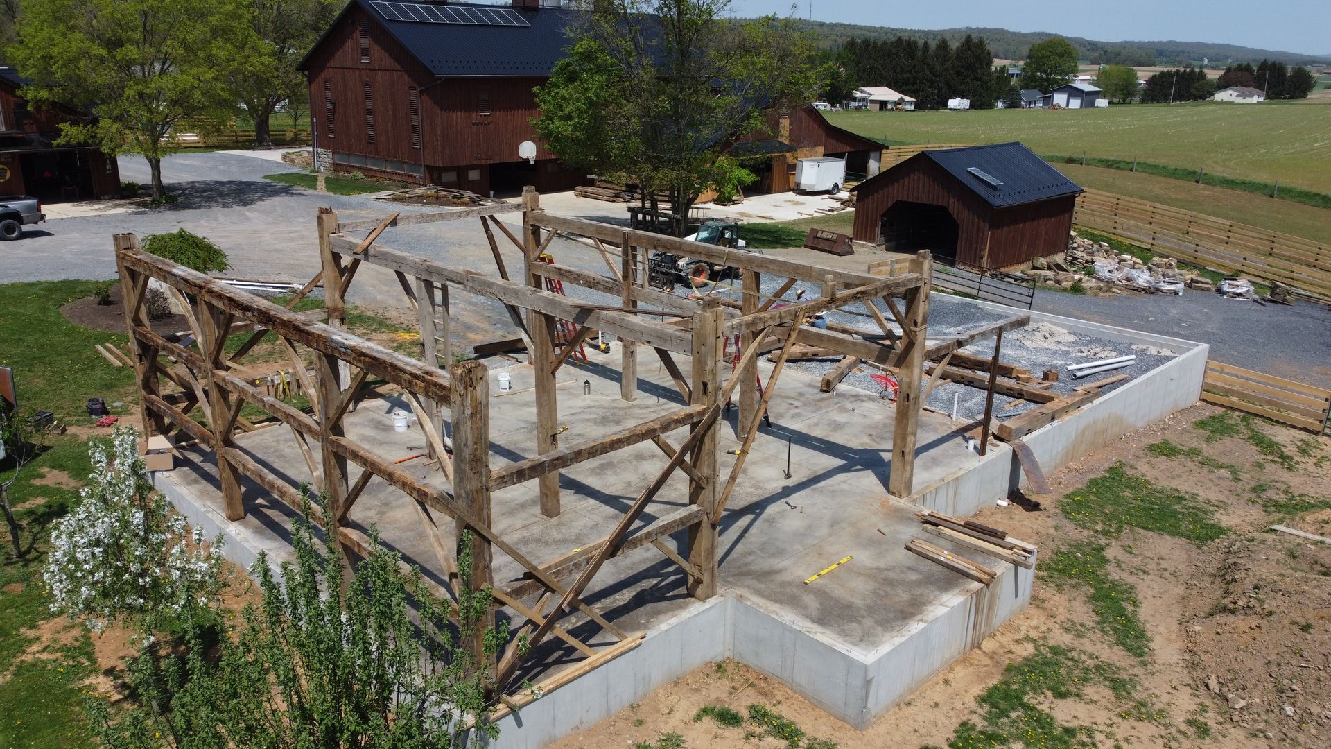 Aerial view of a timber frame structure under construction highlighting building conservation.