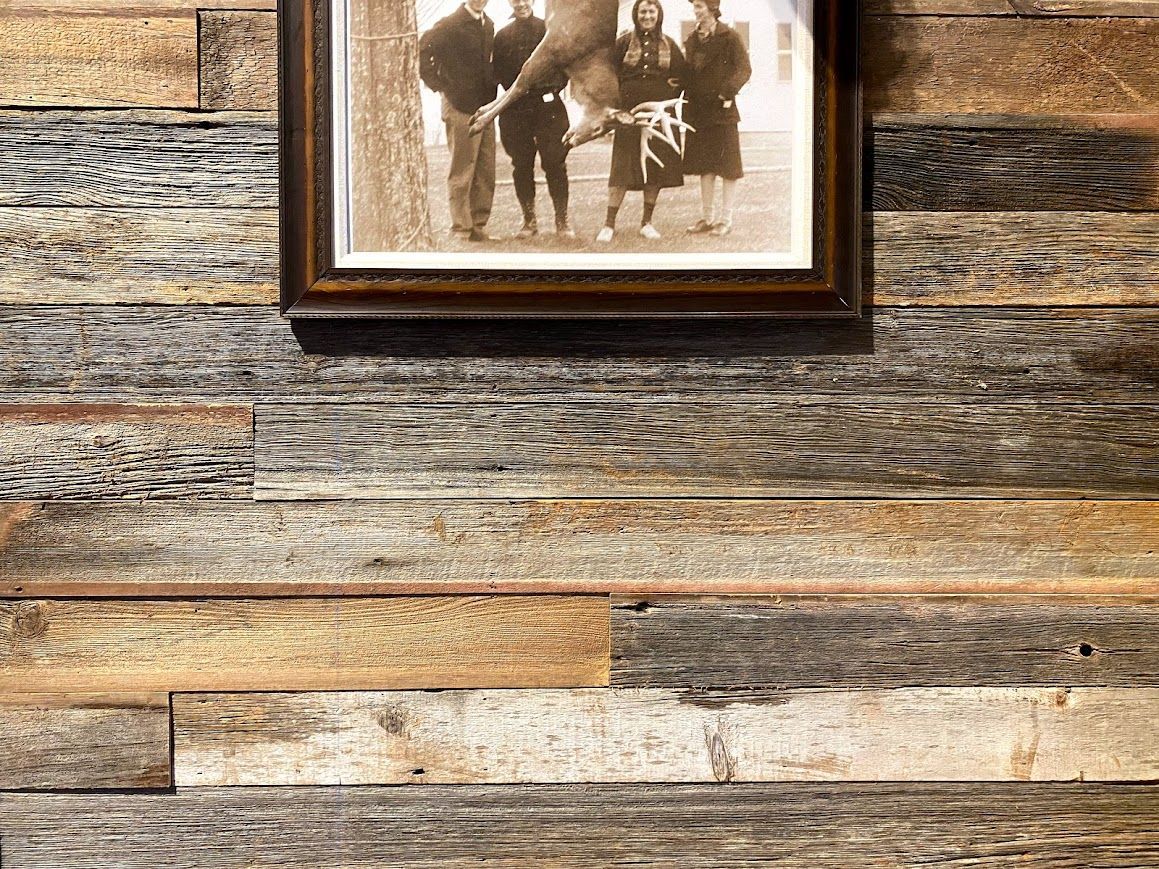 Framed Vintage Photo Hanging on Barnwood Accent Wall in Pennsylvania Home