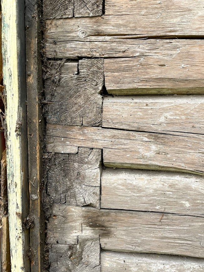 Wooden wall showcasing traditional lap joints.