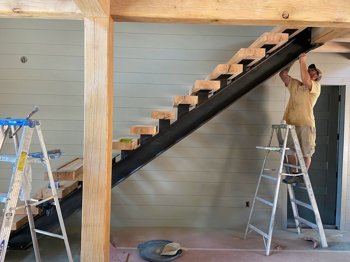 Stunning wooden stair treads and black metal staircase in Pennsylvania