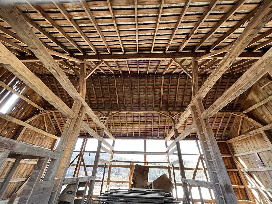 Timber framing viewed inside a barn home project.