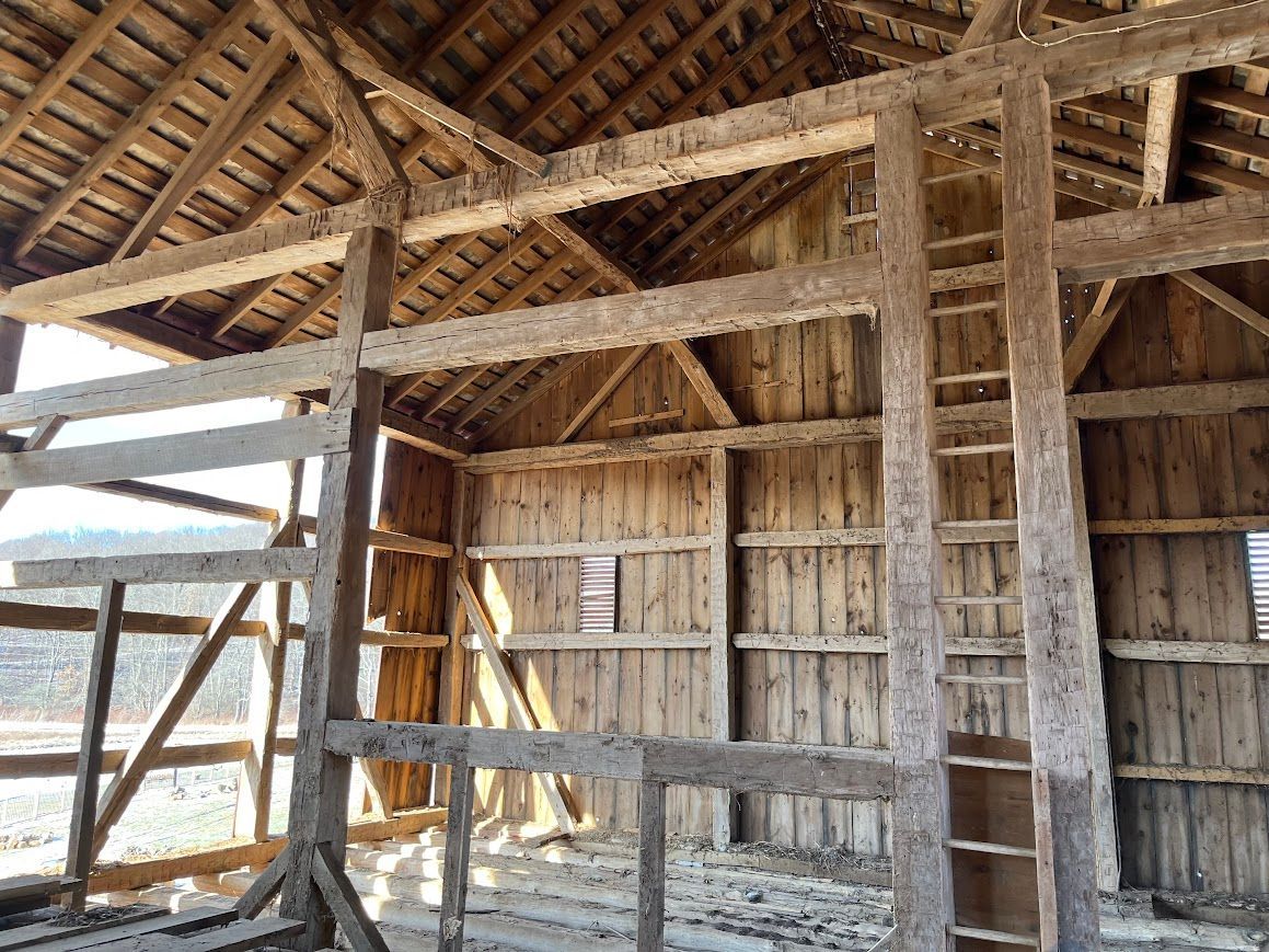 Interior of a rustic barn, ideal for post frame home design.