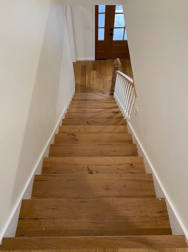 Wooden Staircase Renovation with White Handrail and Glass Doors in Pennsylvania