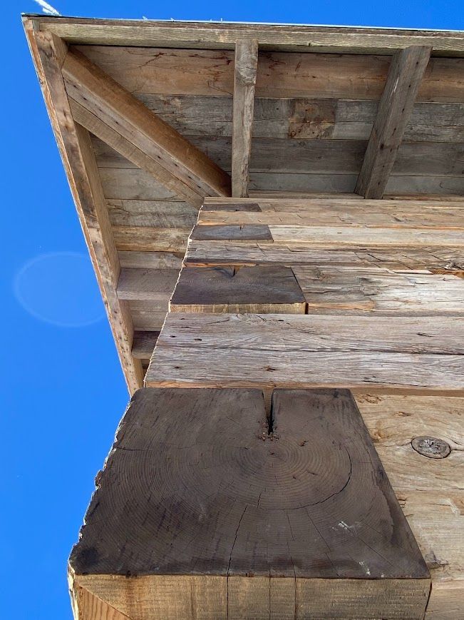 Close-up of wooden beams featuring finger joints.