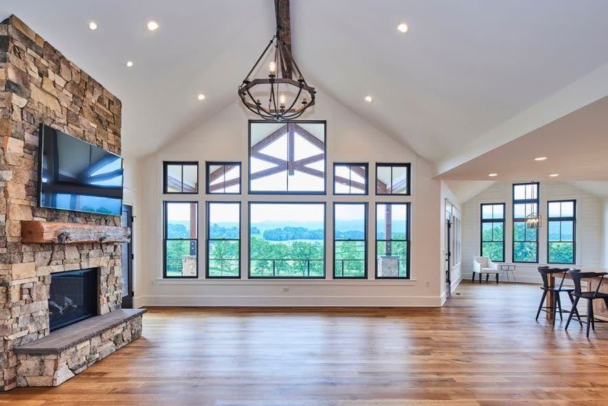 Spacious living room highlighting barn to house conversion cost.