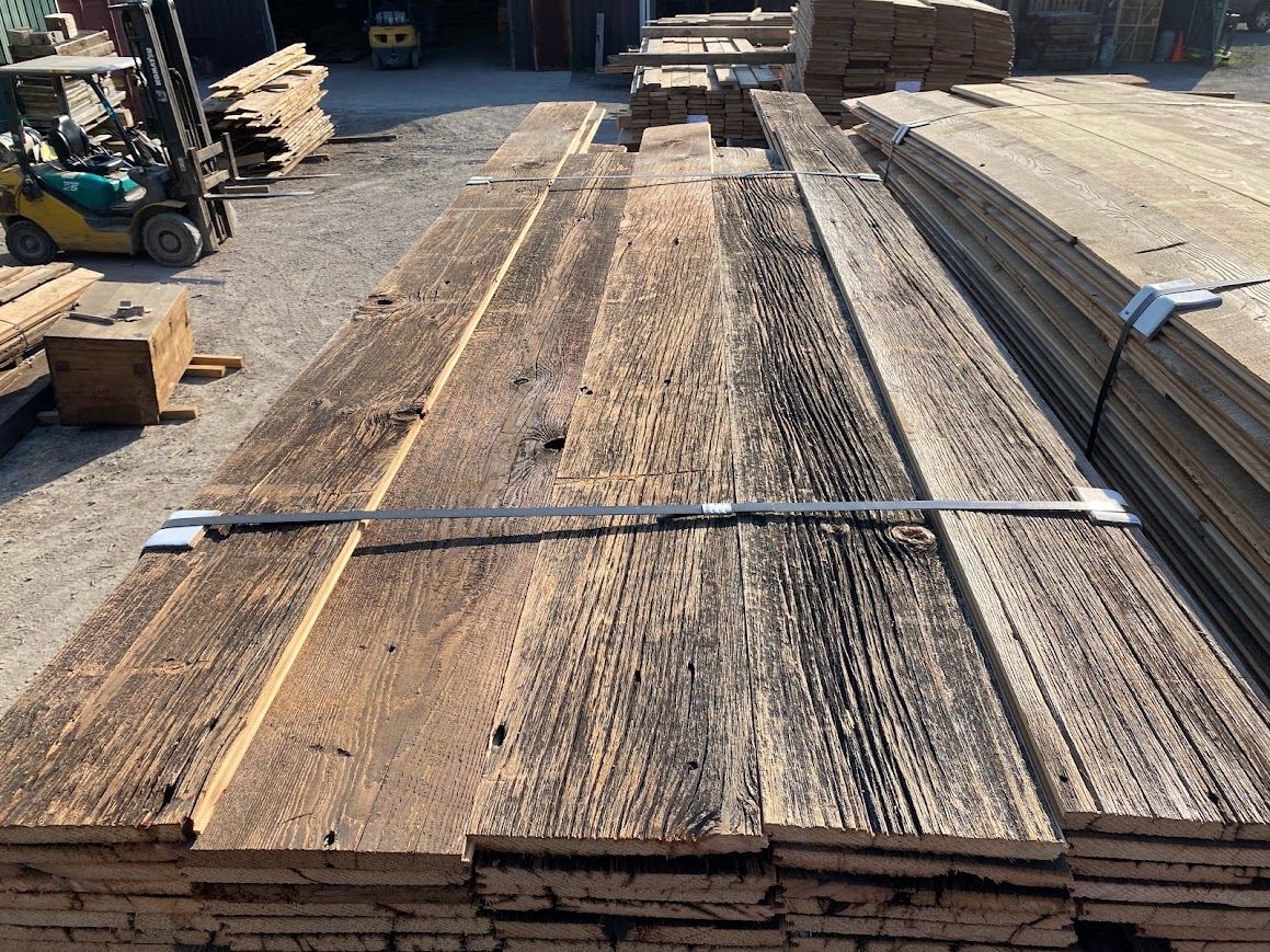 Stacked reclaimed materials in a lumberyard.