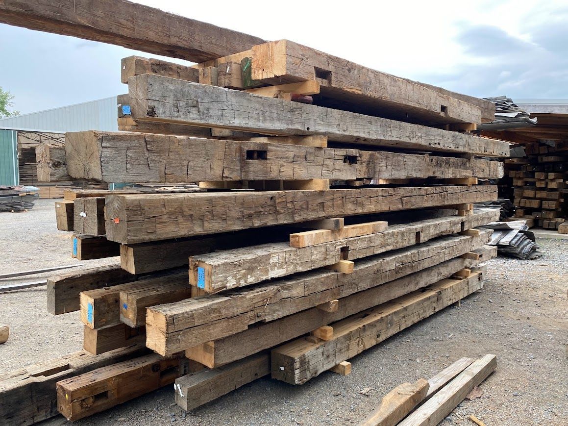 A stack of old barn wood for sale in a lumberyard.