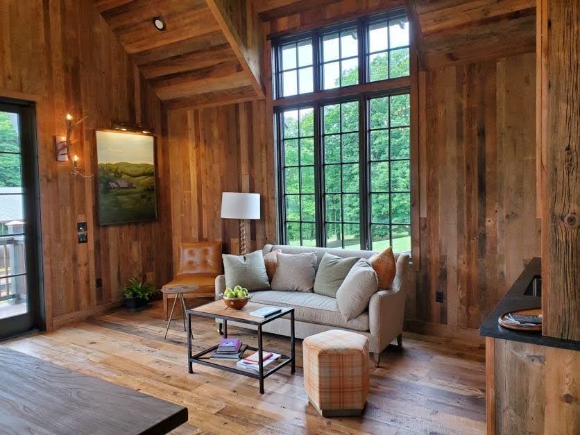 Cozy rustic living room highlighting barndominium cost efficiency.