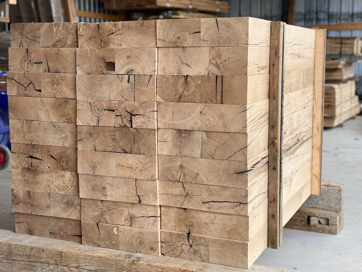 Stack of heat treated reclaimed wood beams with natural grain in America