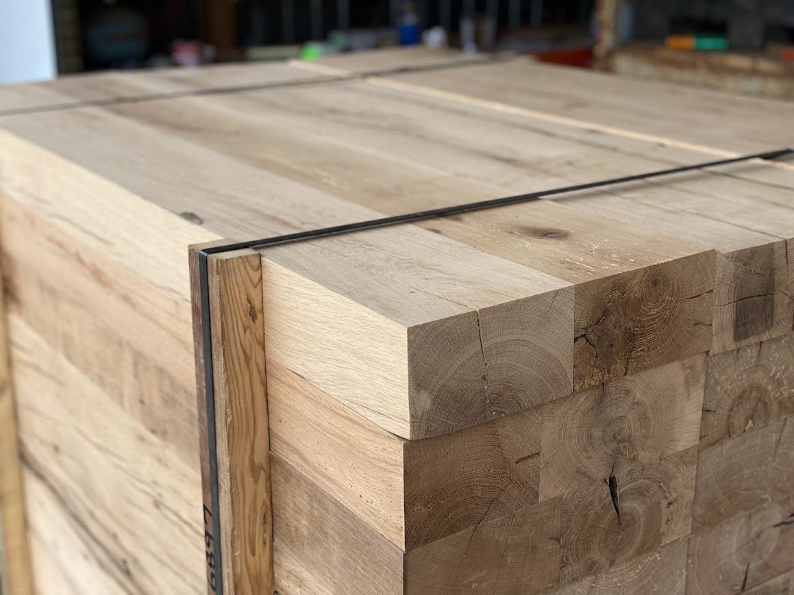 A stack of secured reclaimed wood near me, ready for use.
