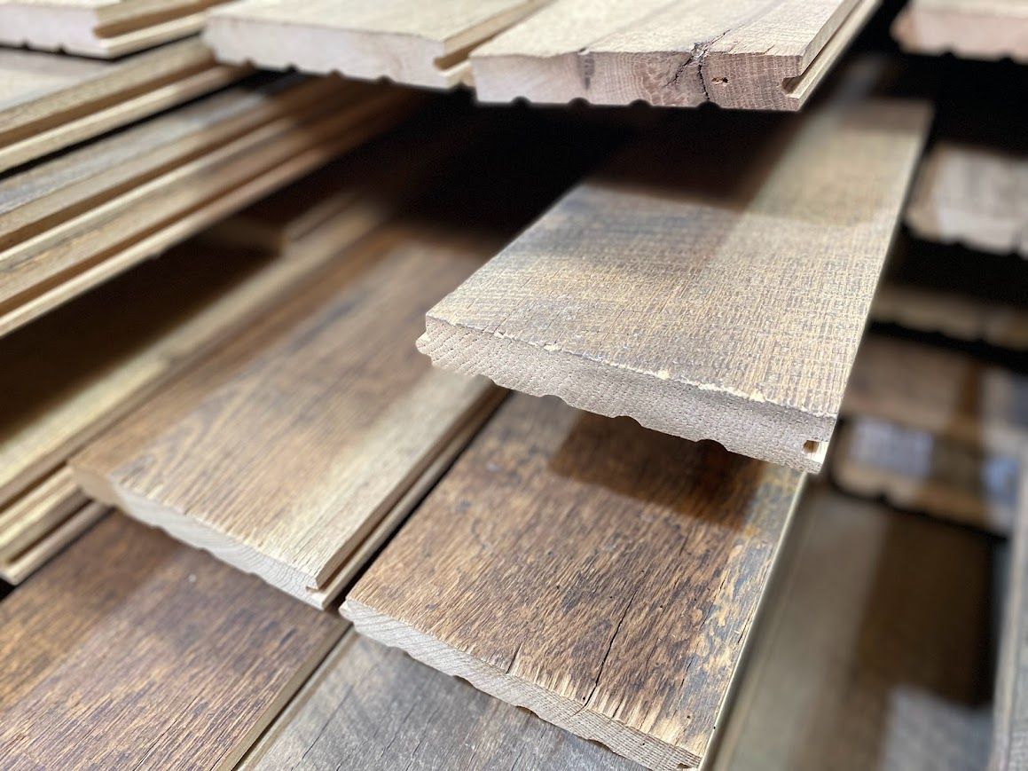 Stack of planks displaying various types of reclaimed wood.