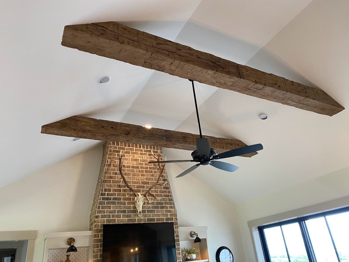 Rustic Interior with Exposed Wood Beams and Brick Chimney in Pennsylvania