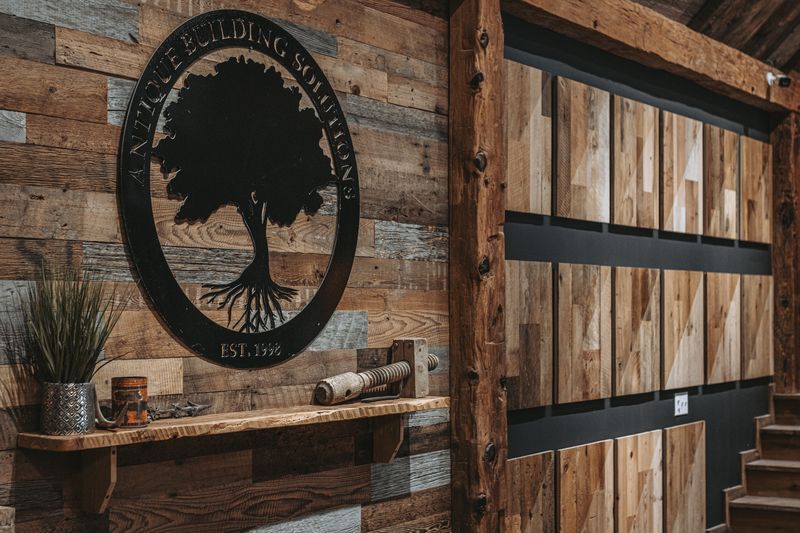 Rustic sign on wall with restored timber frames.