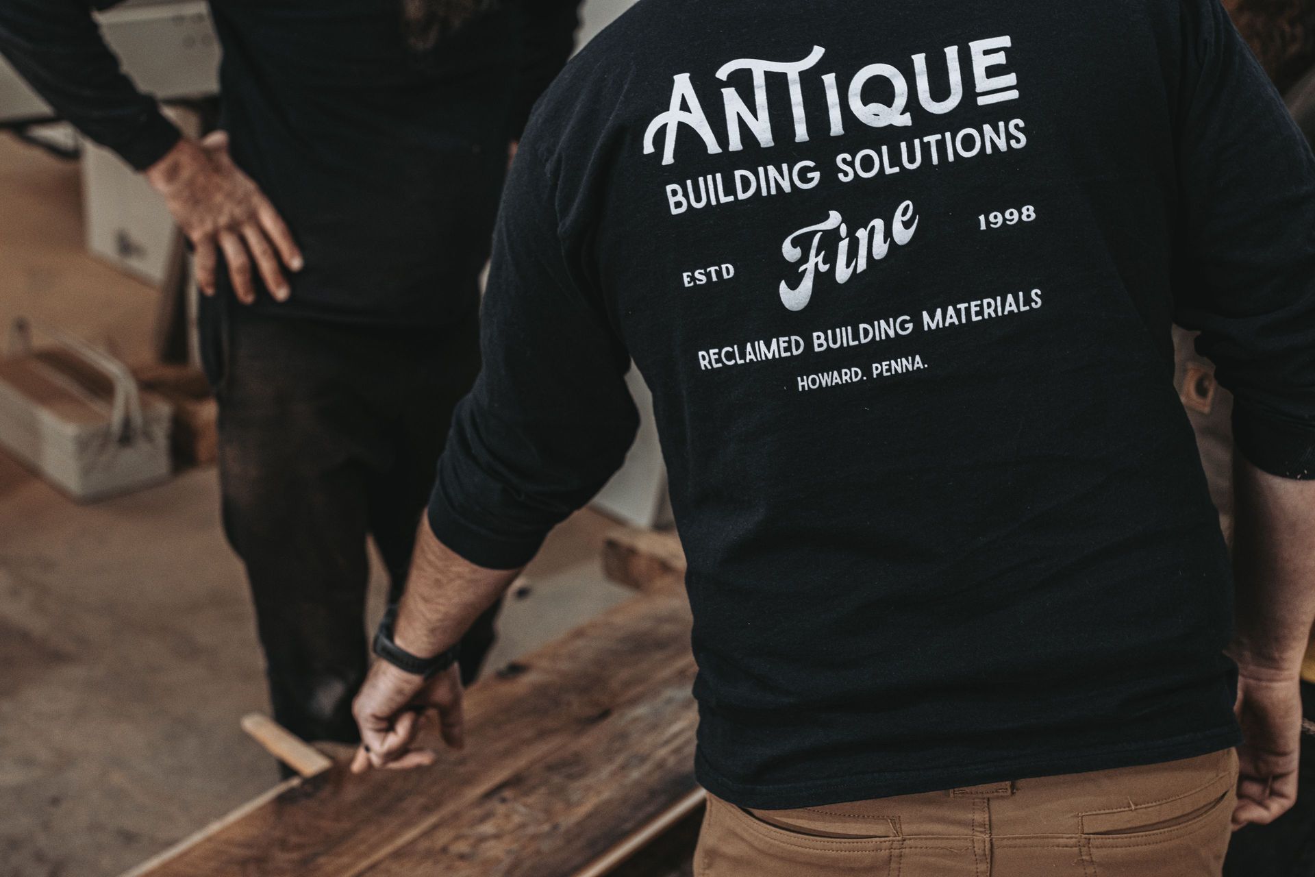 Craftsmen in a workshop conducting structural assessments.