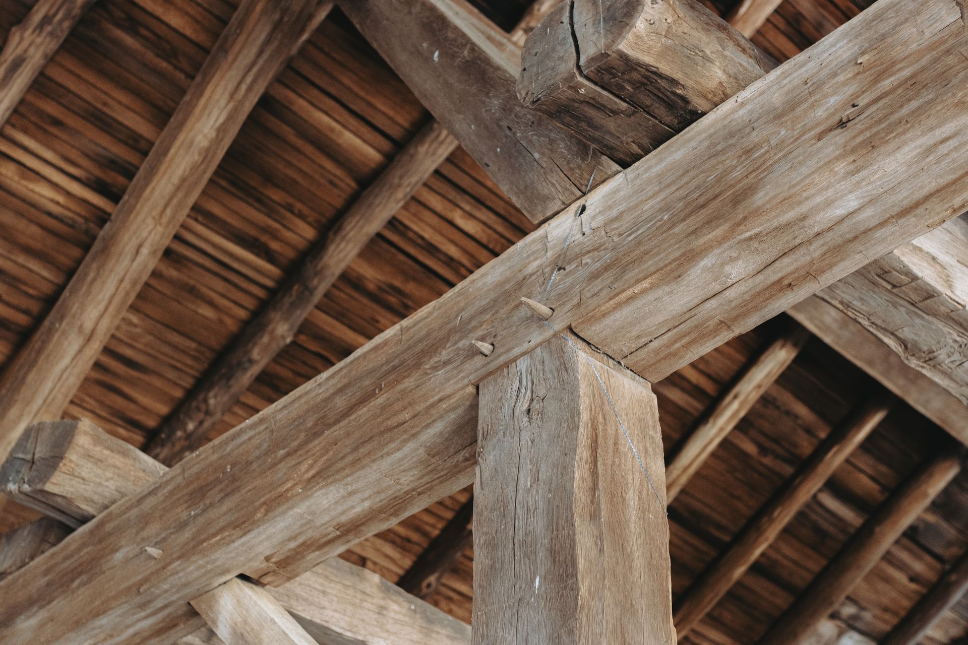 A close up of a wooden structure with a roof.