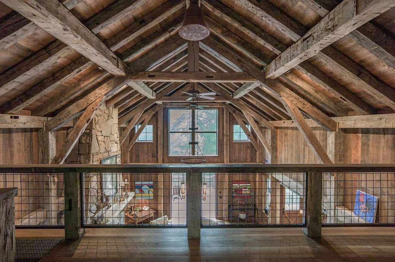 Interior of historic barn homes with exposed beams.