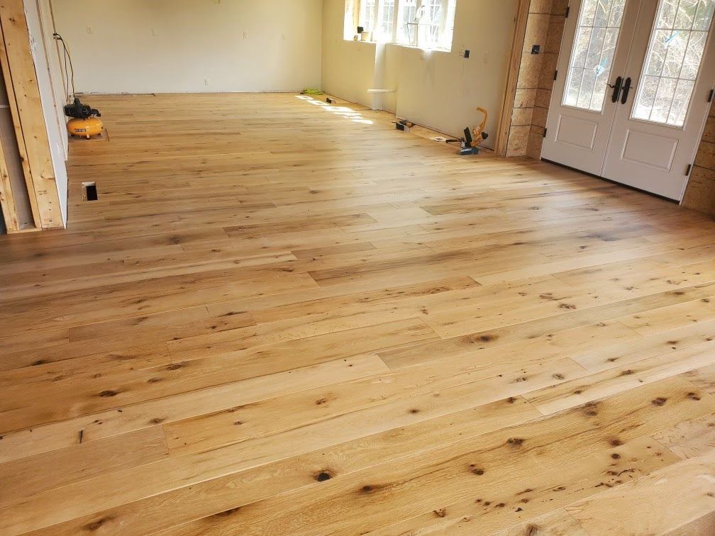 Bright Room with Reclaimed Wood Flooring and Natural Light in Pennsylvania