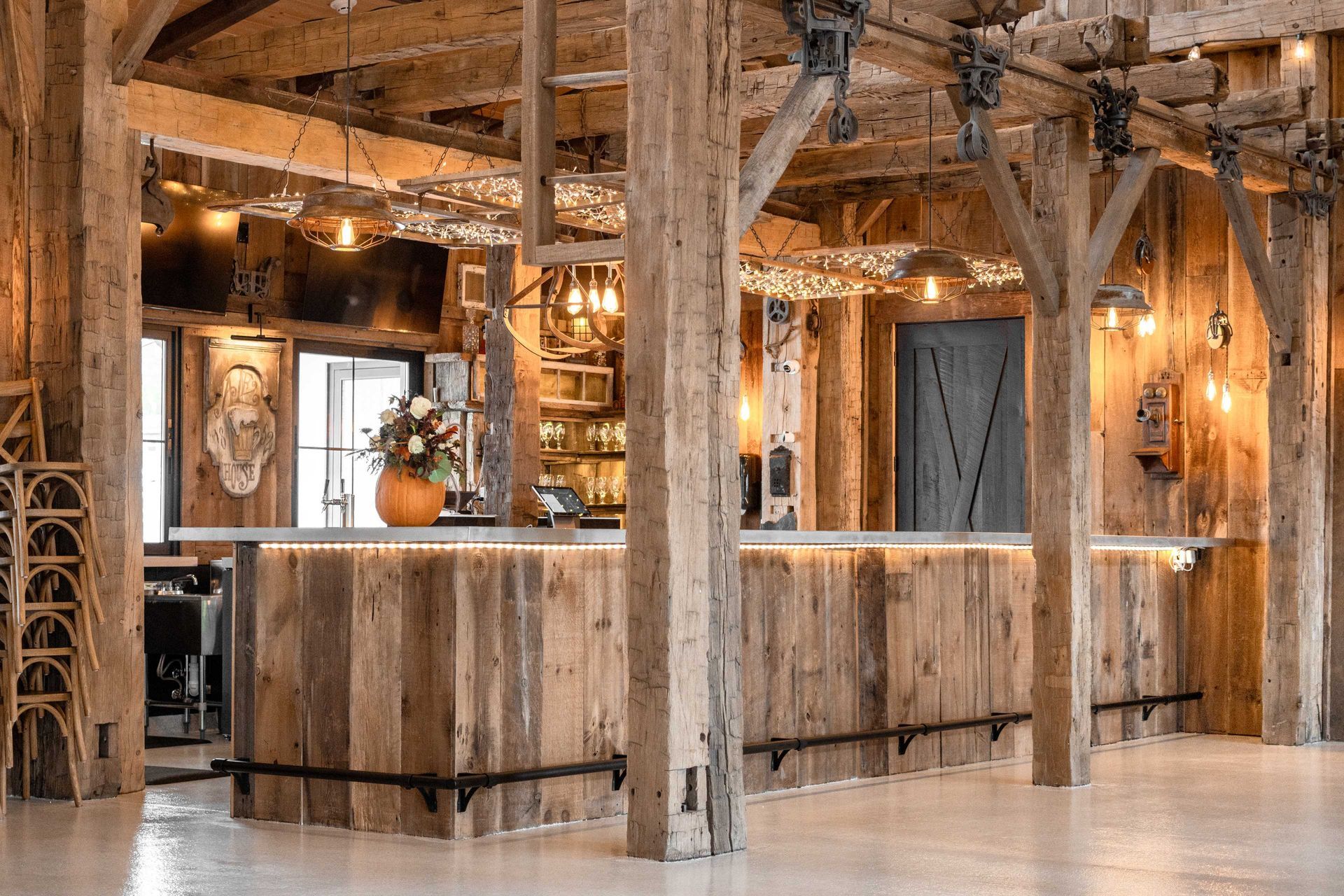A rustic bar interior with hand-hewn timber frame beams for renovation ideas