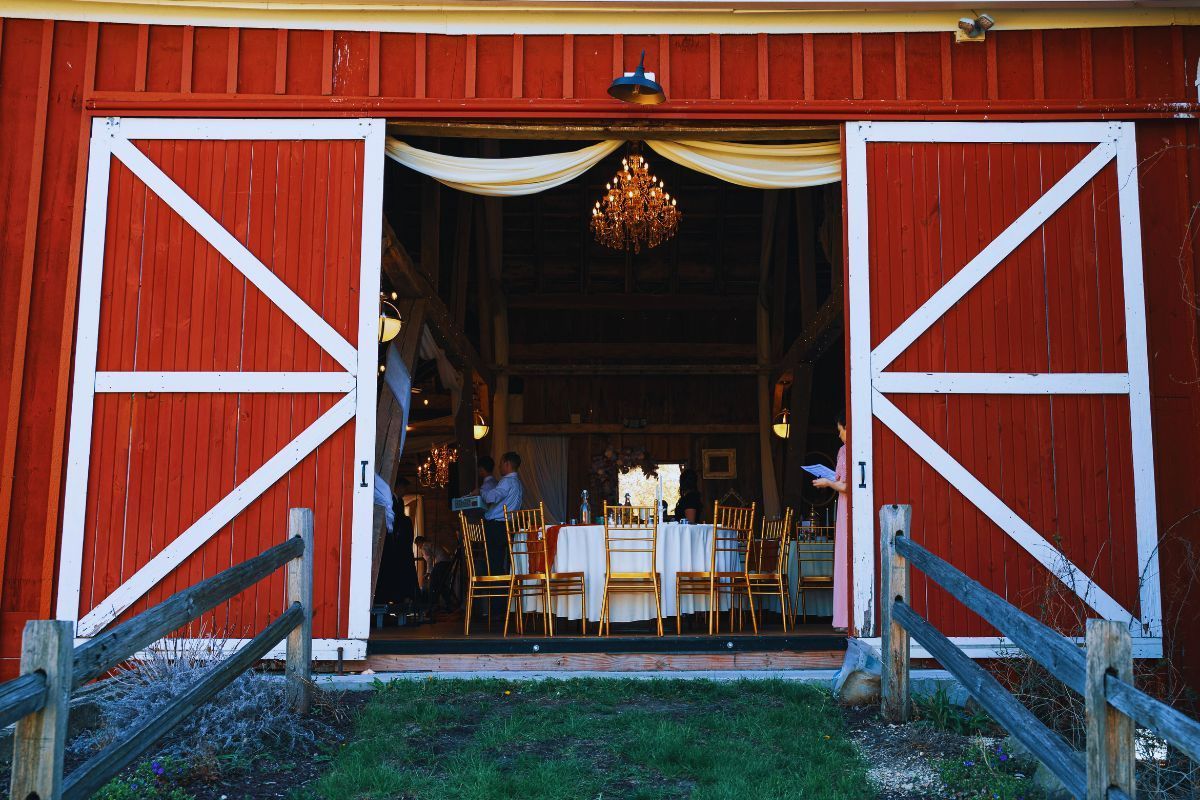 Rustic red barn wedding reception setup in Pennsylvania, perfect for venue inspiration.