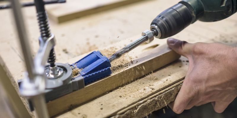 Drilling wood to create pocket screw joints.