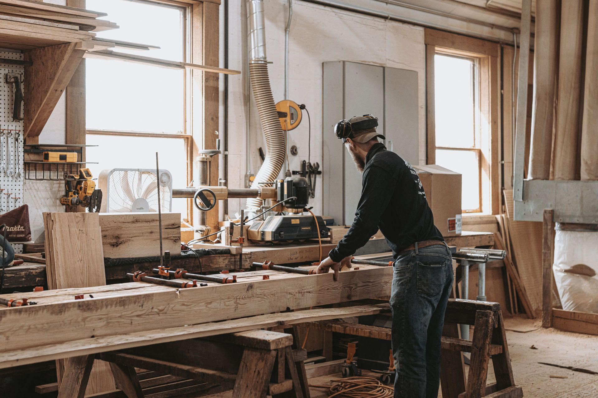 Woodworker crafting materials for architectural preservation projects.