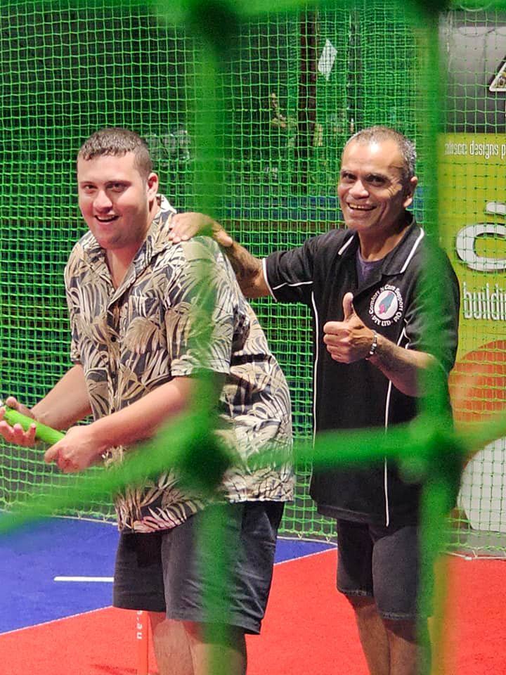 Two Men Are Playing Tennis And One of Them is Giving a Thumbs Up — Comfort N Care Support QLD Pty Ltd In Toowoomba City, QLD