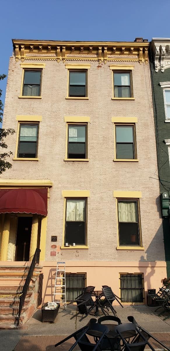 A building with a lot of windows and a red awning