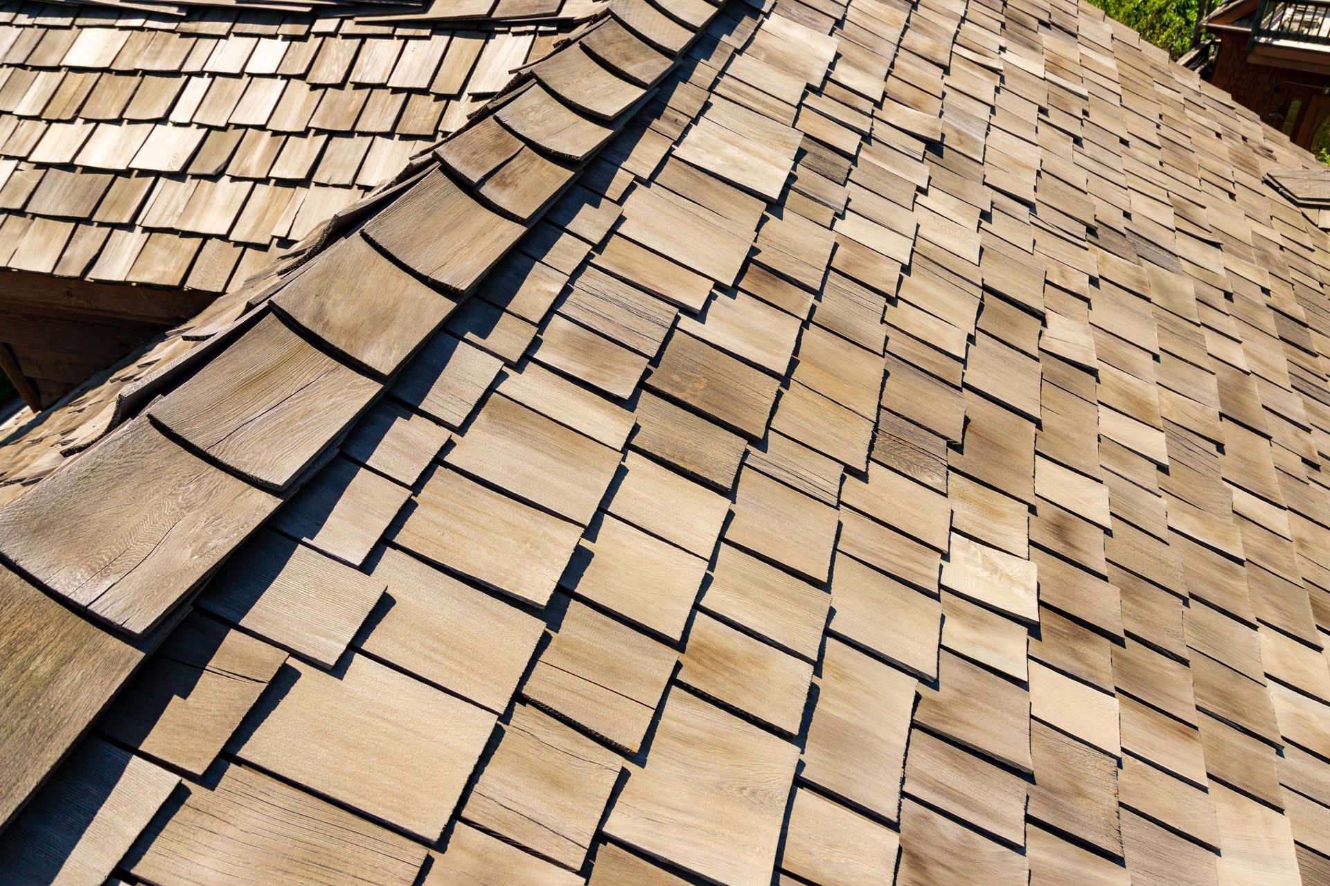 A close up of a wooden roof with shingles