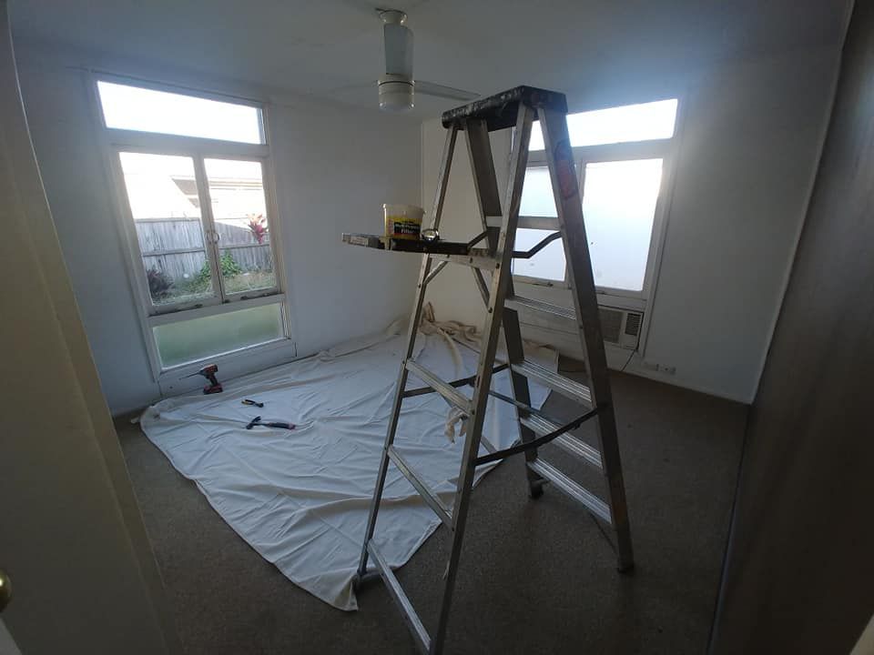 A Ladder Is Sitting in The Middle of A Room — Your Local Handywoman in Burnett Heads, QLD