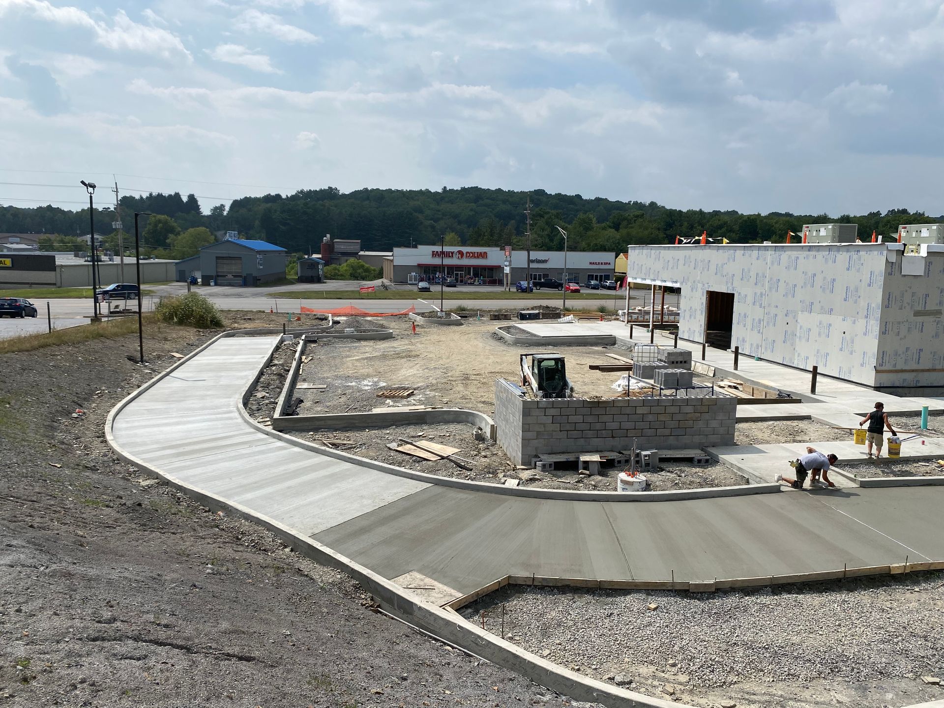 A large pile of gravel is sitting on top of a dirt field.